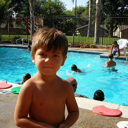 boy by the pool